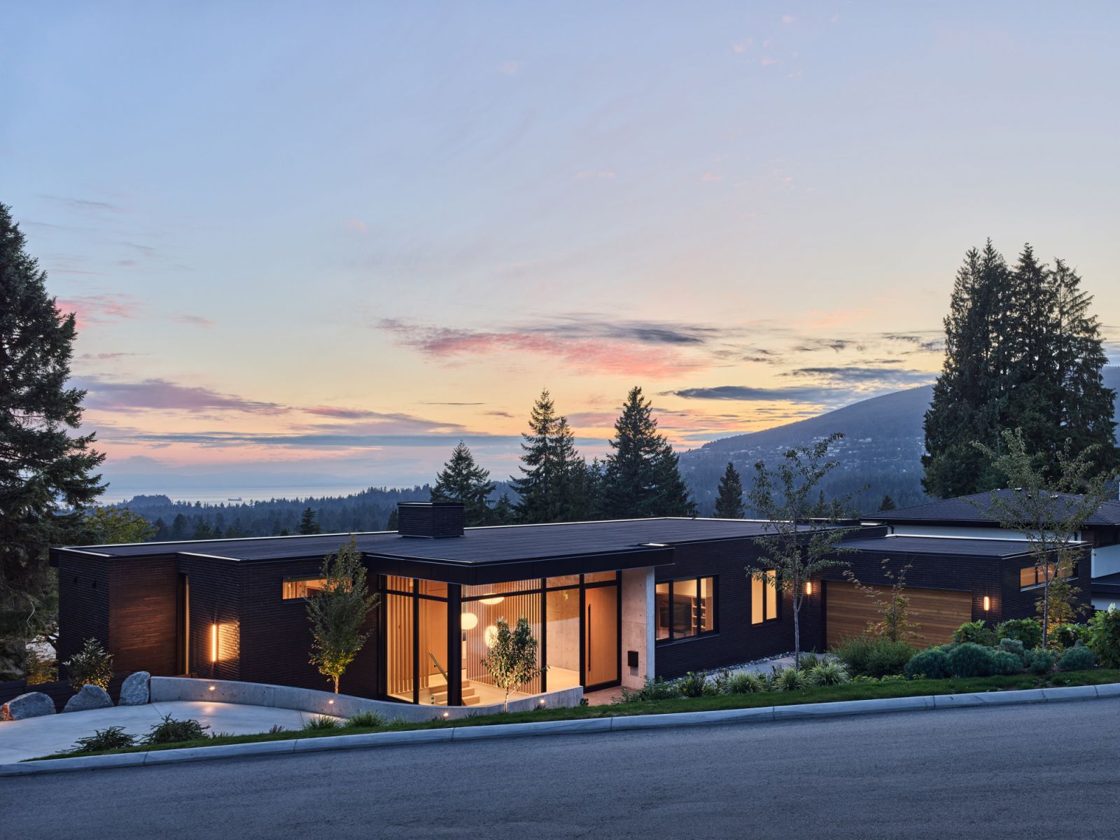 The Vista House emerges as a subtle surprise nestled in the surrounding landscape