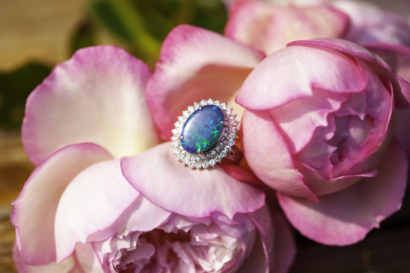 Opal and Diamond ring on pale pink roses (Photo: Melanie Grimes/Getty Images)