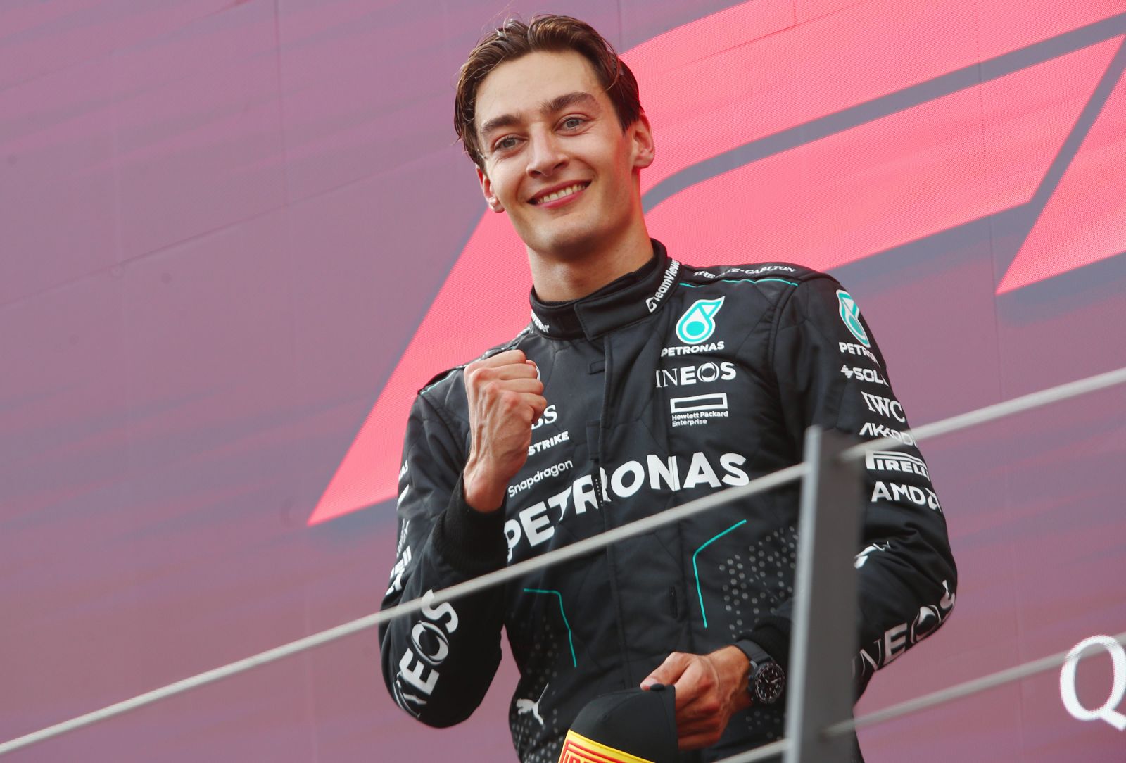 SPIELBERG, AUSTRIA - JUNE 30: Race winner George Russell of Great Britain and Mercedes celebrates on the podium during the F1 Grand Prix of Austria at Red Bull Ring on June 30, 2024 in Spielberg, Austria. (Photo by Joe Portlock - Formula 1/Formula 1 via Getty Images)